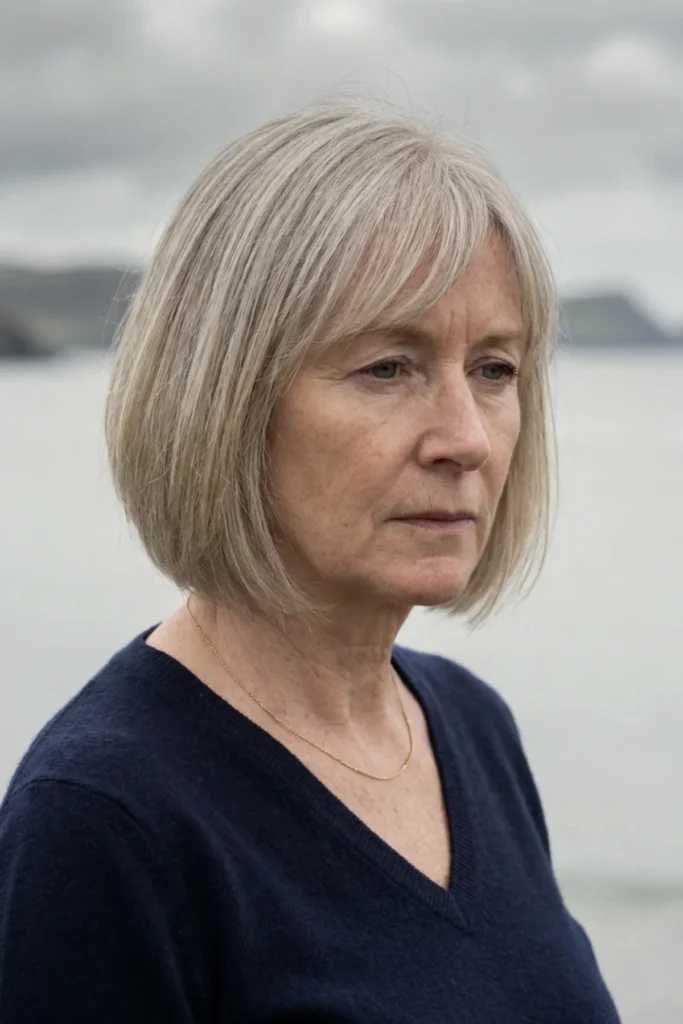 Chin-length bob with side-swept
fringe on fine gray-blonde hair,
smooth polished finish